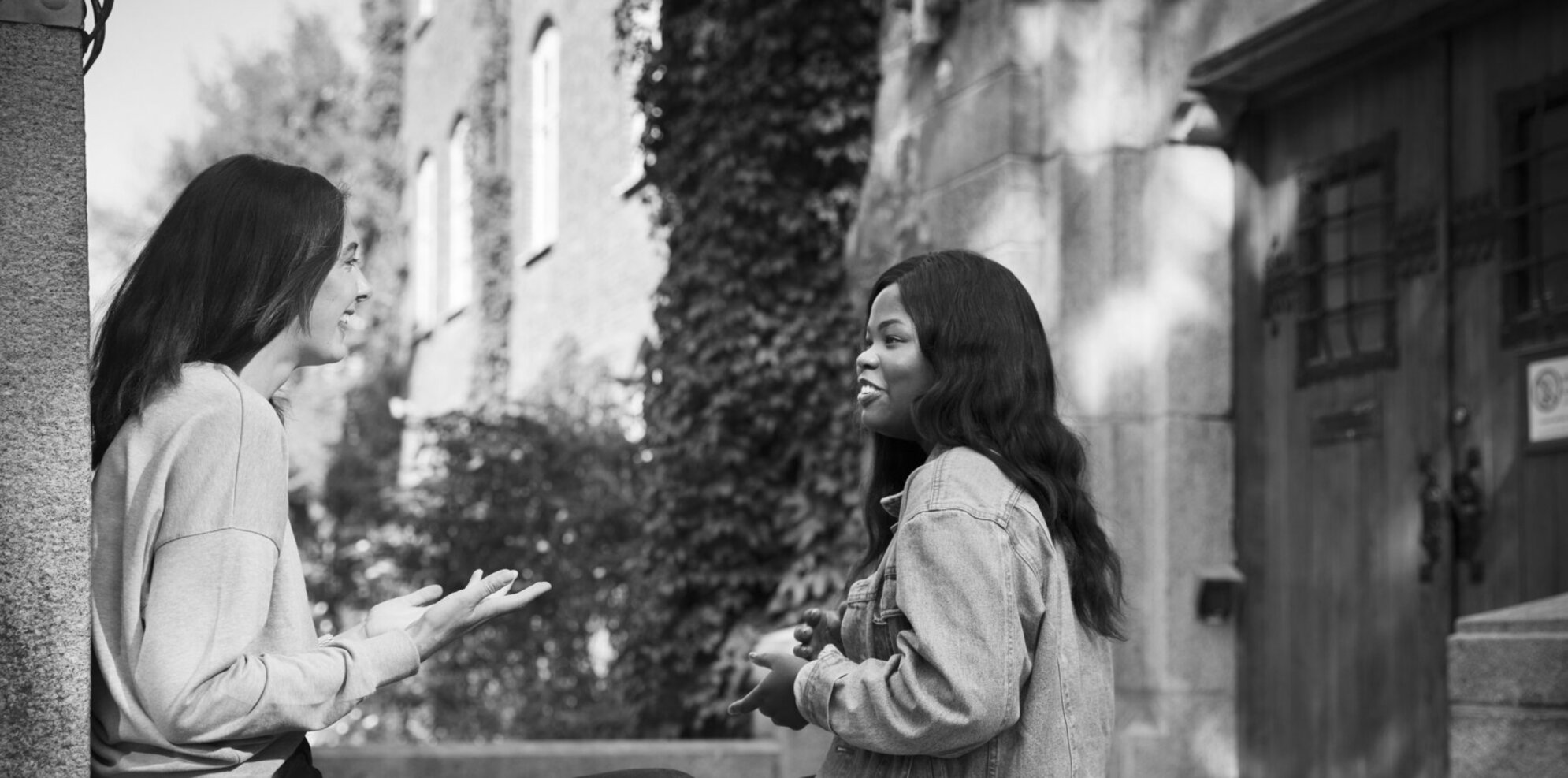 Two students talking with each other.